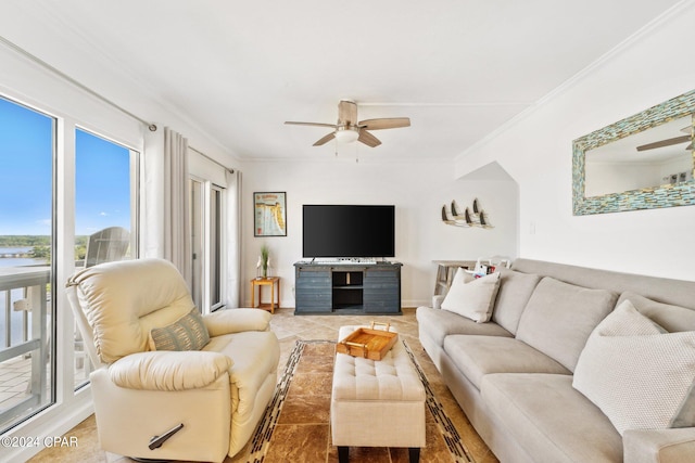 living room featuring ornamental molding, ceiling fan, and plenty of natural light