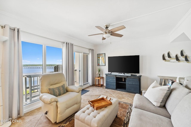 living room with ornamental molding, ceiling fan, and light tile patterned floors