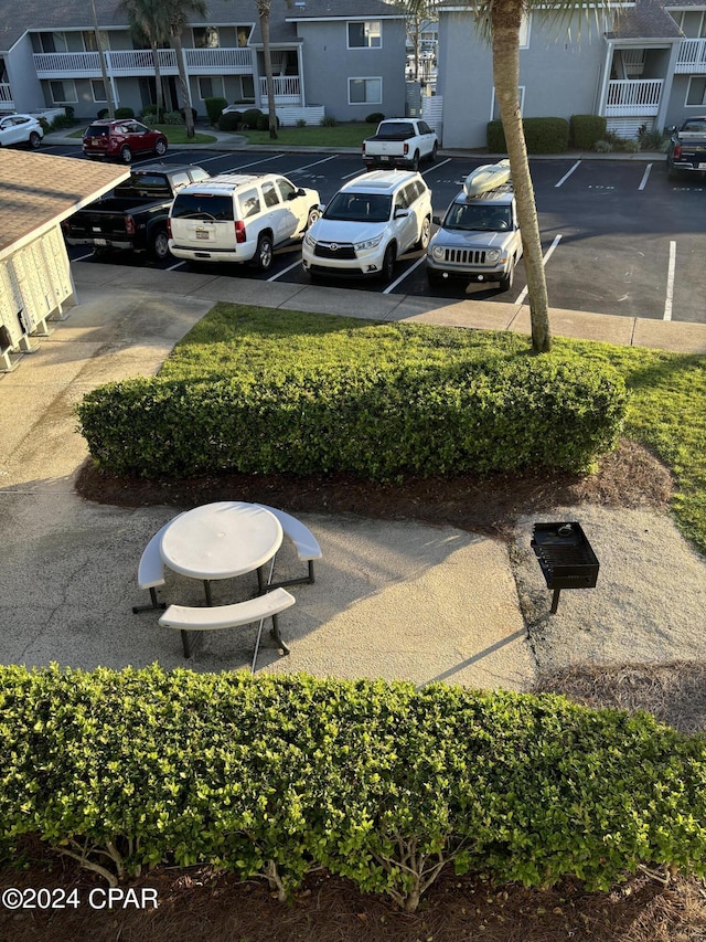 view of parking with a residential view