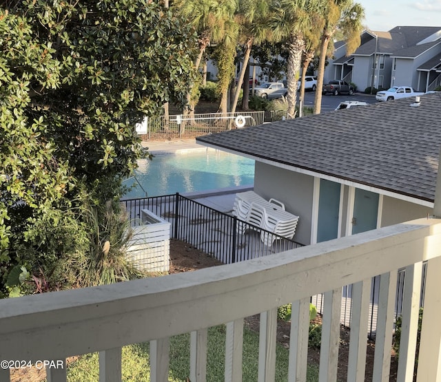 exterior space featuring a residential view and fence