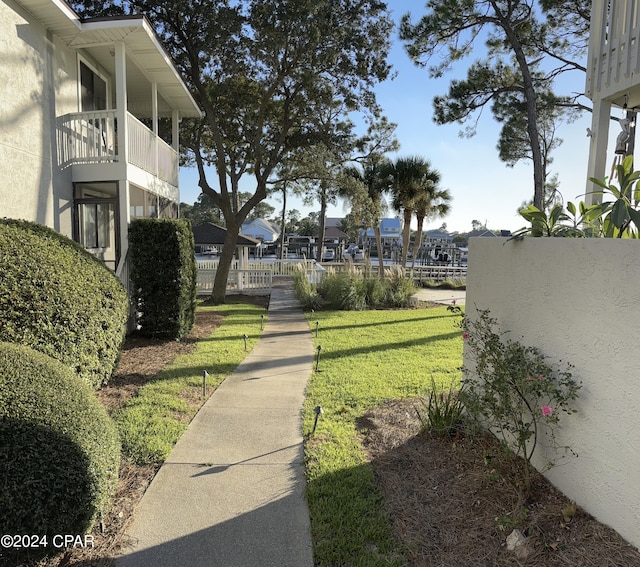 surrounding community featuring a yard