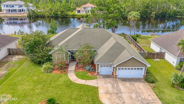 birds eye view of property with a water view