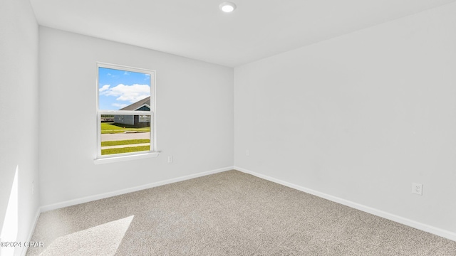 spare room with baseboards, carpet flooring, and recessed lighting