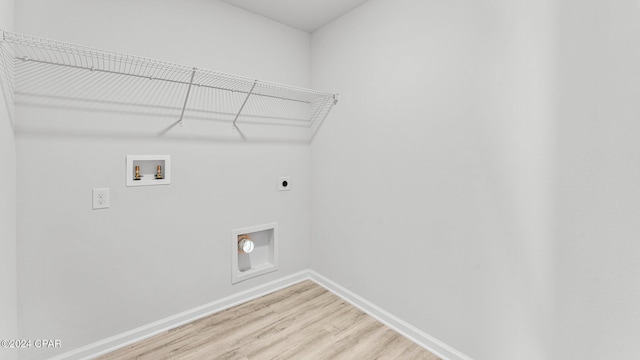 washroom with laundry area, baseboards, light wood-style floors, washer hookup, and electric dryer hookup