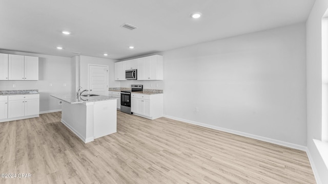 kitchen featuring appliances with stainless steel finishes, light wood-style flooring, visible vents, and recessed lighting