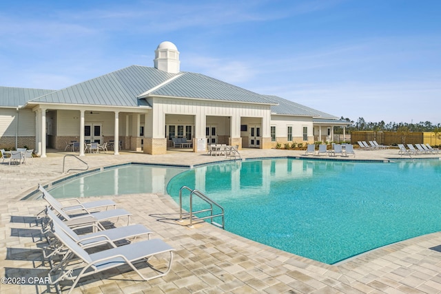 pool featuring a patio area and fence