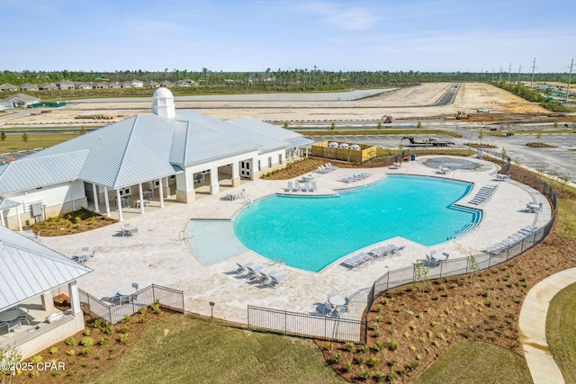 pool featuring a patio and fence