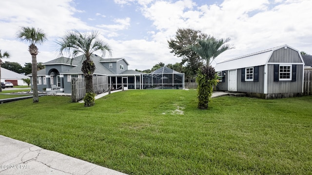 exterior space featuring a front yard, a storage unit, and a lanai