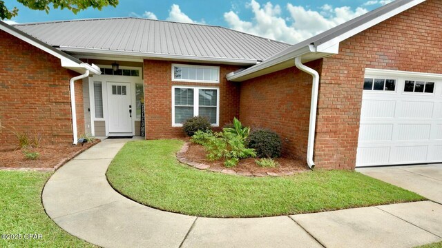 exterior space with a lawn and a garage