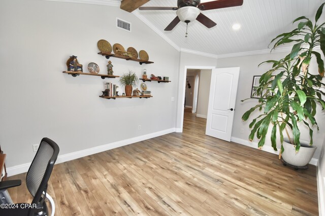 home office with ornamental molding, light wood-type flooring, ceiling fan, and lofted ceiling with beams