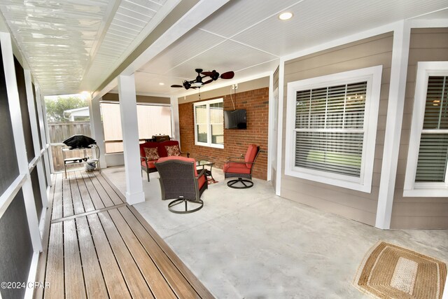 deck with a patio, ceiling fan, and an outdoor hangout area