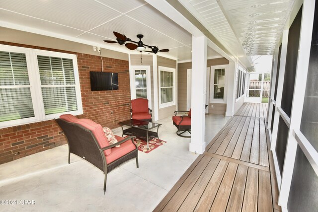 deck featuring ceiling fan and a patio area