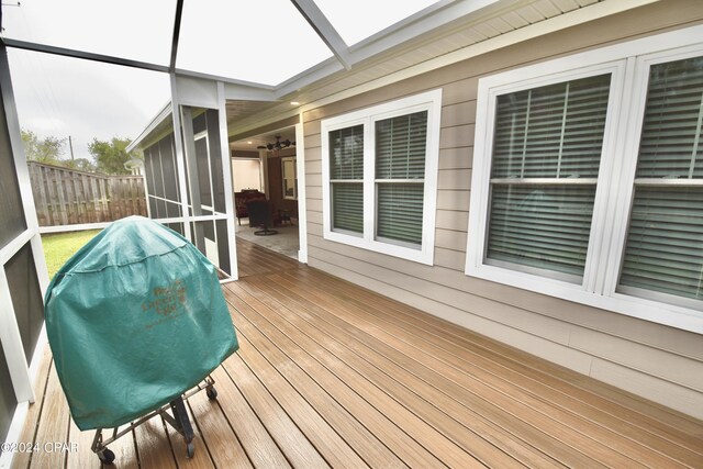 wooden terrace with a grill