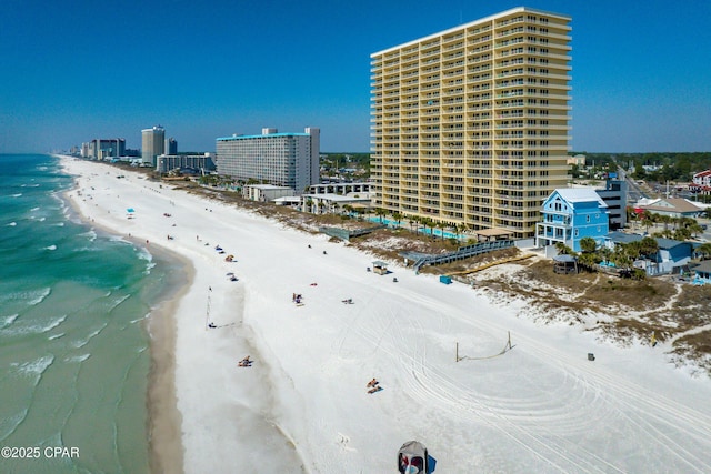 bird's eye view with a view of city, a water view, and a beach view