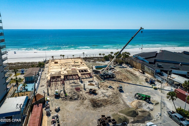 bird's eye view featuring a view of the beach and a water view