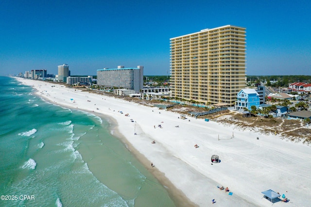 birds eye view of property with a city view, a water view, and a beach view