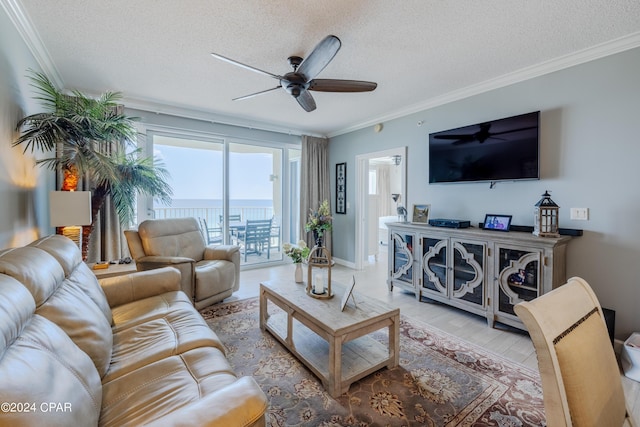 9450 S Thomas Dr Unit 402, Panama City, FL 32408 - living area featuring ceiling fan, a textured ceiling, ornamental molding, and baseboards