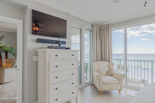 9450 S Thomas Dr Unit 402, Panama City, FL 32408 - living area featuring crown molding, light wood-style flooring, and ceiling fan