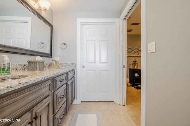 bathroom featuring vanity and tile patterned flooring