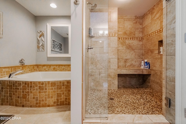 bathroom featuring independent shower and bath and tile patterned floors