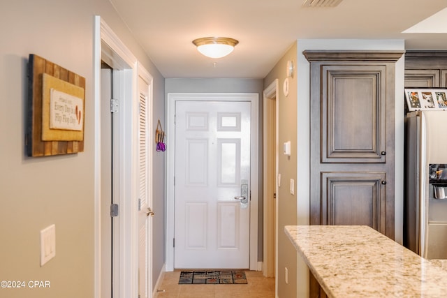 entryway featuring light tile patterned floors