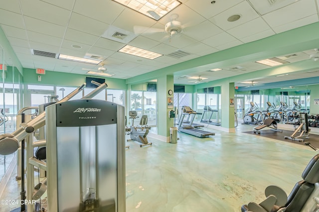 9450 S Thomas Dr Unit 402, Panama City, FL 32408 - workout area with a ceiling fan, a drop ceiling, and baseboards