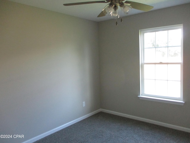 unfurnished room featuring ceiling fan and carpet flooring