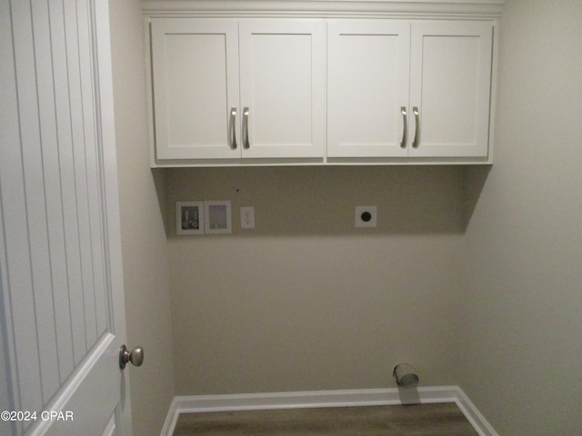 clothes washing area featuring washer hookup, electric dryer hookup, and cabinets