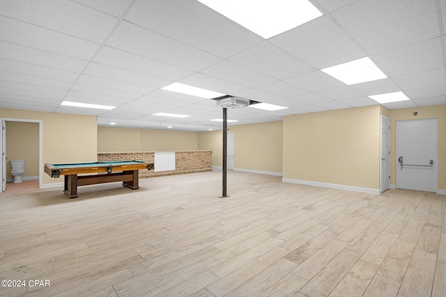 game room featuring billiards, light wood-type flooring, and a paneled ceiling