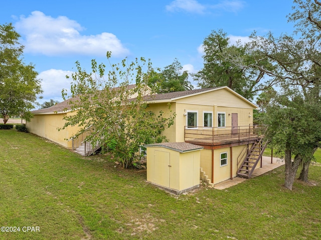 back of house with a yard