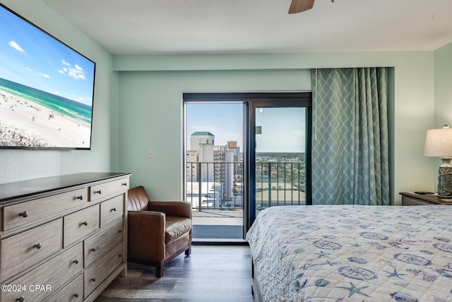 bedroom with multiple windows, ceiling fan, dark hardwood / wood-style flooring, and access to outside