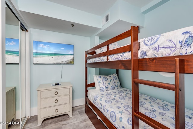 bedroom with light hardwood / wood-style floors