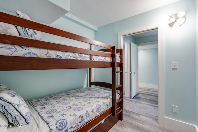 bedroom with light wood-type flooring