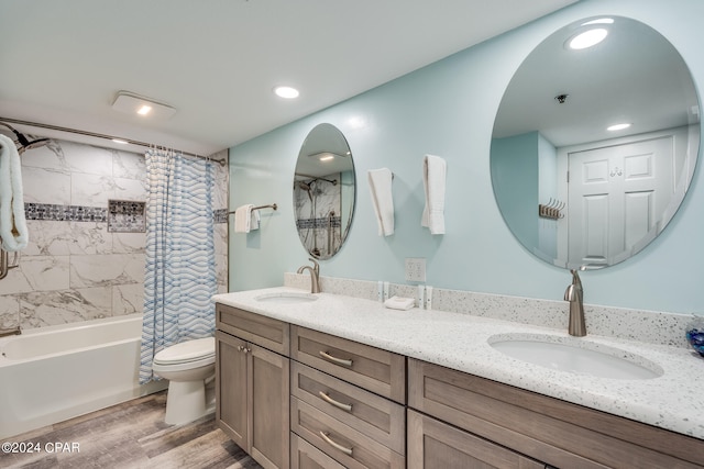 full bathroom featuring shower / bath combo, vanity, toilet, and hardwood / wood-style flooring