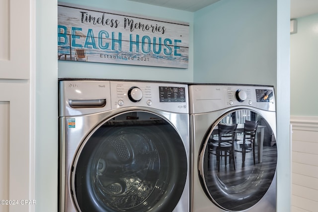 washroom with washing machine and clothes dryer