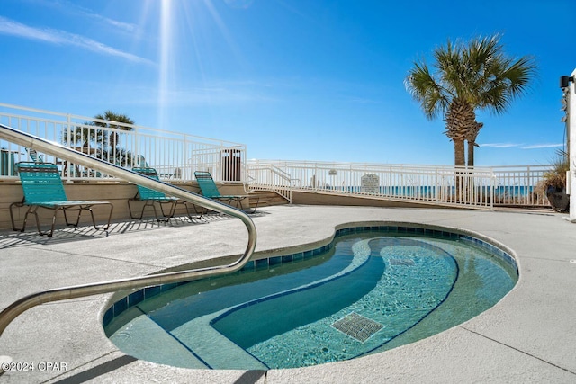 view of swimming pool featuring a patio area