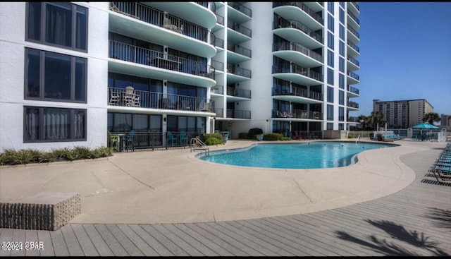 view of swimming pool with a patio area