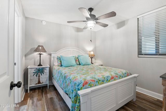 bedroom with ceiling fan and dark wood-type flooring