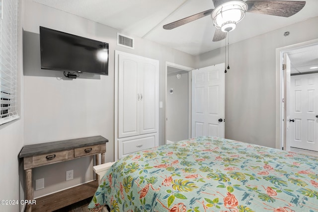 bedroom with ceiling fan and wood-type flooring