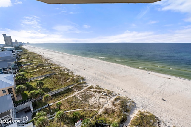 exterior space featuring a water view and a beach view