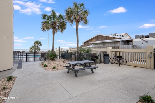 view of patio featuring a fenced in pool