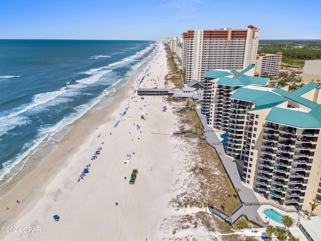 drone / aerial view featuring a view of the beach and a water view