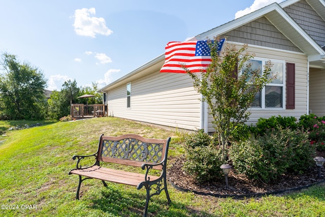 view of home's exterior with a lawn