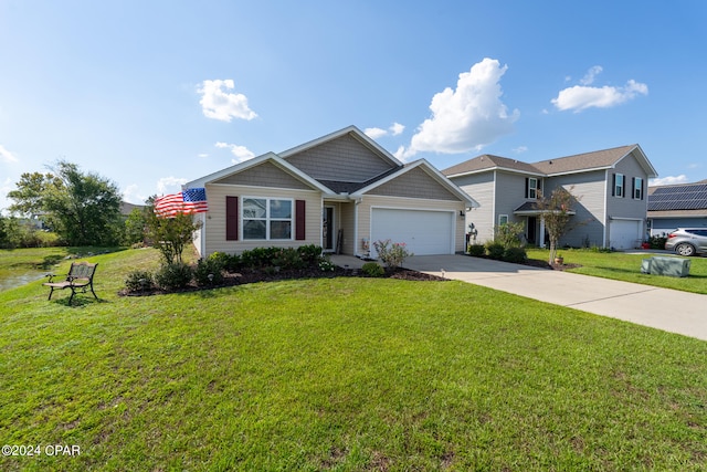 view of front of home featuring a front yard and a garage