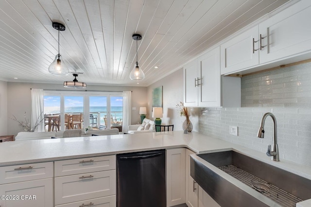 kitchen with pendant lighting, sink, black dishwasher, white cabinets, and wooden ceiling