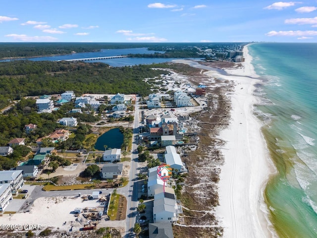 bird's eye view featuring a view of the beach and a water view