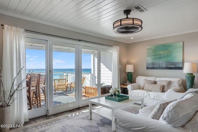 living room with a water view, wood ceiling, ornamental molding, and hardwood / wood-style floors