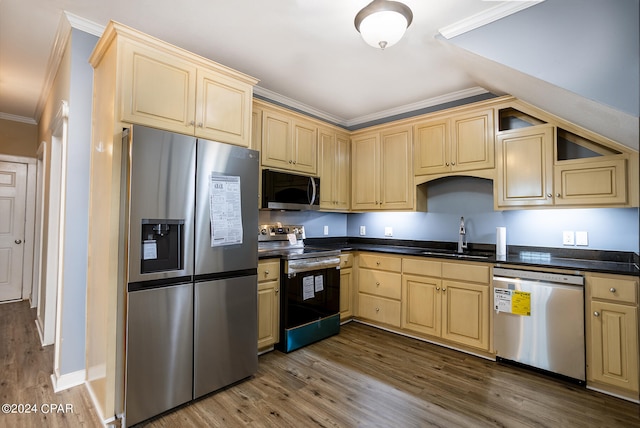 kitchen with appliances with stainless steel finishes, crown molding, sink, and dark hardwood / wood-style floors