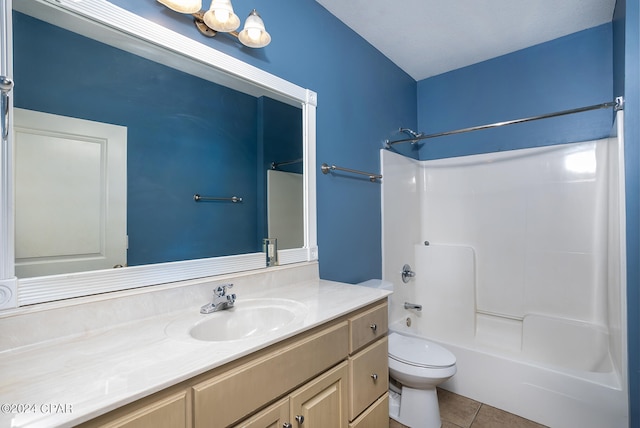 full bathroom featuring vanity, tile patterned floors, toilet, and shower / bathtub combination