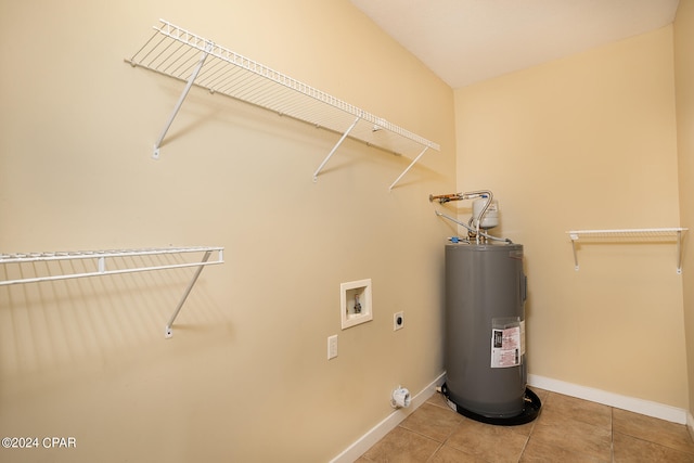 washroom with hookup for an electric dryer, tile patterned floors, hookup for a washing machine, and water heater